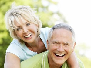 Older happy couple in countryside